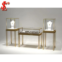 Vitrine à bijoux en métal avec éclairage LED en verre incurvé sur mesure, comptoir en marbre de luxe, écologique