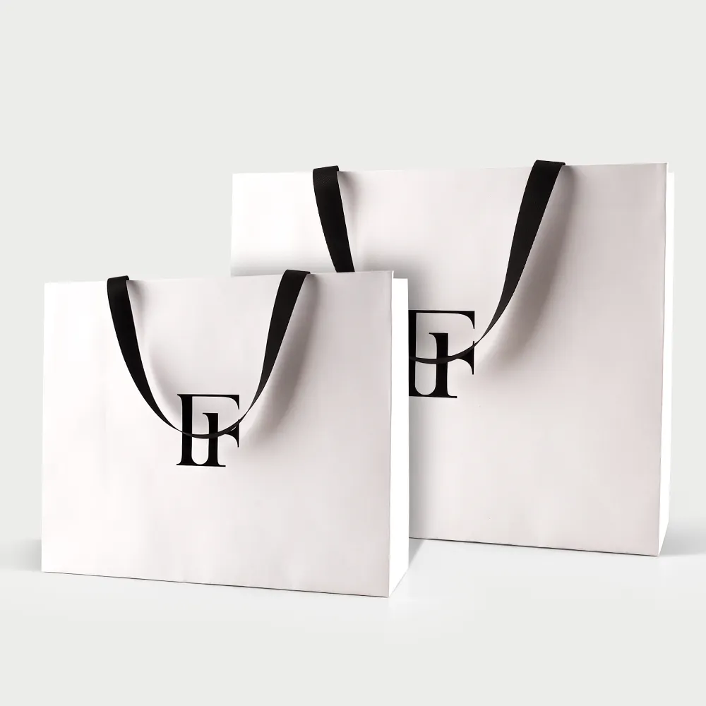 卸売カスタムプリントロゴ高級ホワイトペーパーバッグ小売ブティックショッピングギフトペーパーバッグあなた自身のロゴ