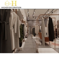 Vitrine de magasin de vêtements moderne, présentoir de vêtements en métal de luxe, présentoir de vêtements personnalisé, mobilier de magasin de vêtements durable