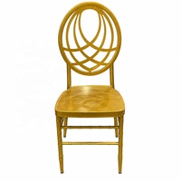 Chaise de banquet empilable en métal doré OEM ODM, chaise Chiavari durable à dossier croisé en fer pour événements de mariage, hôtels et extérieur
