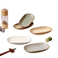 Assiette ovale en céramique émaillée haut de gamme japonaise, résistante au micro-ondes, motif uni, pour restaurant commercial, idéale pour l'export.