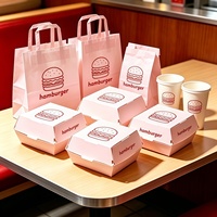 Kartonnen hamburgerdozen in lichtroze kleur met burger-schetslogo, wegwerpbaar, food grade, voor afhaalmaaltijden, fastfoodverpakkingen