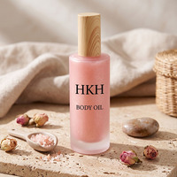 Aceite corporal en spray HKH personalizable de marca privada con brillo de perlas finas, nutritivo, blanqueador, de larga duración, con aroma y color personalizados.