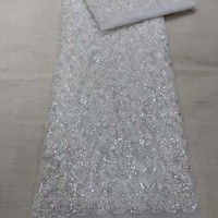 Tissu de dentelle africaine de luxe perlé et brodé de sequins pour robe, tissu de dentelle brodé nigérian pour mariée
