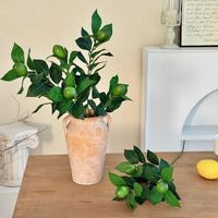 Vente en gros de branches de citron artificielles réalistes et réutilisables, aspect naturel, feuillage de faux citron pour arrangements floraux