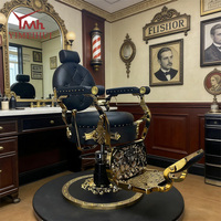 Chaise de barbier vintage de luxe, accoudoirs dorés décoratifs, cuir noir matelassé diamant, avec support hydraulique