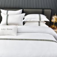 Ensemble de literie de luxe avec sangles brodées, 4 pièces, housse de couette blanche pure pour hôtel 5 étoiles, vente en gros