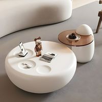 Table basse de salon durable au design unique et contemporain, cadre rond en bois blanc avec plateau en verre