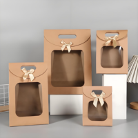 Nouveau style de sac cadeau de luxe en carton ivoire, portable, avec fenêtre, support à nœud solide, sacs en papier écologiques et durables