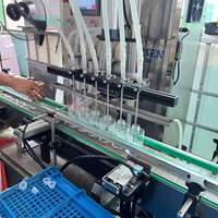 Machine automatique de capsulage de remplissage de bouteilles d'huile essentielle liquide pompe de diffuseur de verre composants de base PLC ligne de Machines d'emballage