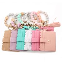Vente de gros Bracelet en perles de silicone, porte-clés Bracelet porte-cartes en PU porte-clés avec bracelet assorti Portefeuille/