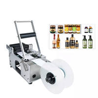 Étiqueteuse manuelle simple autocollant adhésif de bouteille ronde avec poignée étiqueteuse bouteille de vin petite machine d'emballage