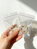 Pochette d'emballage transparente en plastique pour bijoux avec fermeture à bouton, estampage à chaud pour lunettes et bijoux, sac auto-scellant