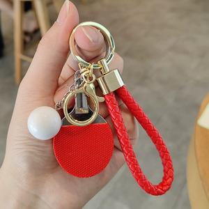 Nuevo Llavero para Amantes del Deporte, Correa de Cuero Trenzado para Teléfono, Colgantes Creativos para Mochila Deportiva, Llaveros de Raqueta de Tenis de Mesa - Product Image 1