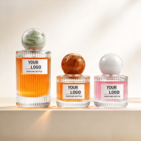 Flacon de parfum en verre transparent cylindrique vide portable de 30 ml et 100 ml avec bouchon sphérique coloré pour le transfert de parfum et le stockage de fragrances