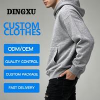 Sweat-shirt en coton gris chiné pour homme, coupe oversize, avec logo personnalisé, poche kangourou, épaules tombantes et poignets côtelés, idéal pour l'hiver