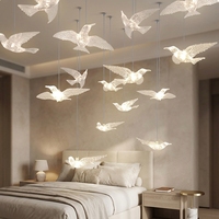 Nouvelle conception de lustre suspendu en acrylique LED moderne personnalisé pour la décoration des escaliers de la villa du hall de l'hôtel