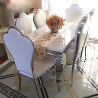 Ensemble de table à manger carrée minimaliste en marbre avec chaises à structure en acier inoxydable doré pour villa et mobilier de maison