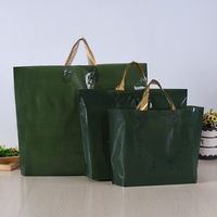 Vente en gros de sacs fourre-tout en plastique imprimés de haute qualité de marque personnalisés, imprimés pour cadeau de vêtement