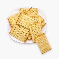 Galletas de coco comprimidas con energía, textura crujiente sin azúcar, cebolla salada, sabor a huevo, proceso de laminación al horno, bolsa a granel para aperitivos