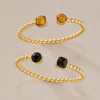 Bracelet manchette torsadé J&D Designer Vintage en acier inoxydable plaqué or 18 carats PVD avec ambre en résine naturelle
