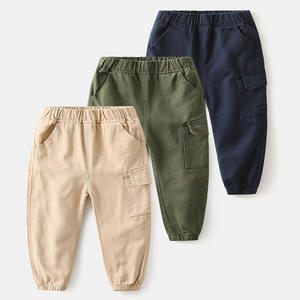 Pantalons décontractés pour enfants et hommes, avec poches latérales, en tissu uni, fabriqués au Pakistan, achat en gros depuis la Chine - Product Image 1