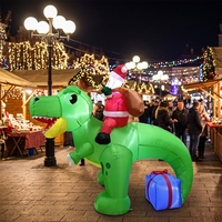 Père Noël gonflable lumineux sur un Tyrannosaurus Rex vert avec boîte cadeau pour la décoration de jardin, boutique, festival, exposition