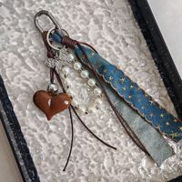 Pendentif de sac en jean marron en forme de cœur papillon de la série Miu avec porte-clés en alliage tressé simple, style mode haut de gamme pour femme