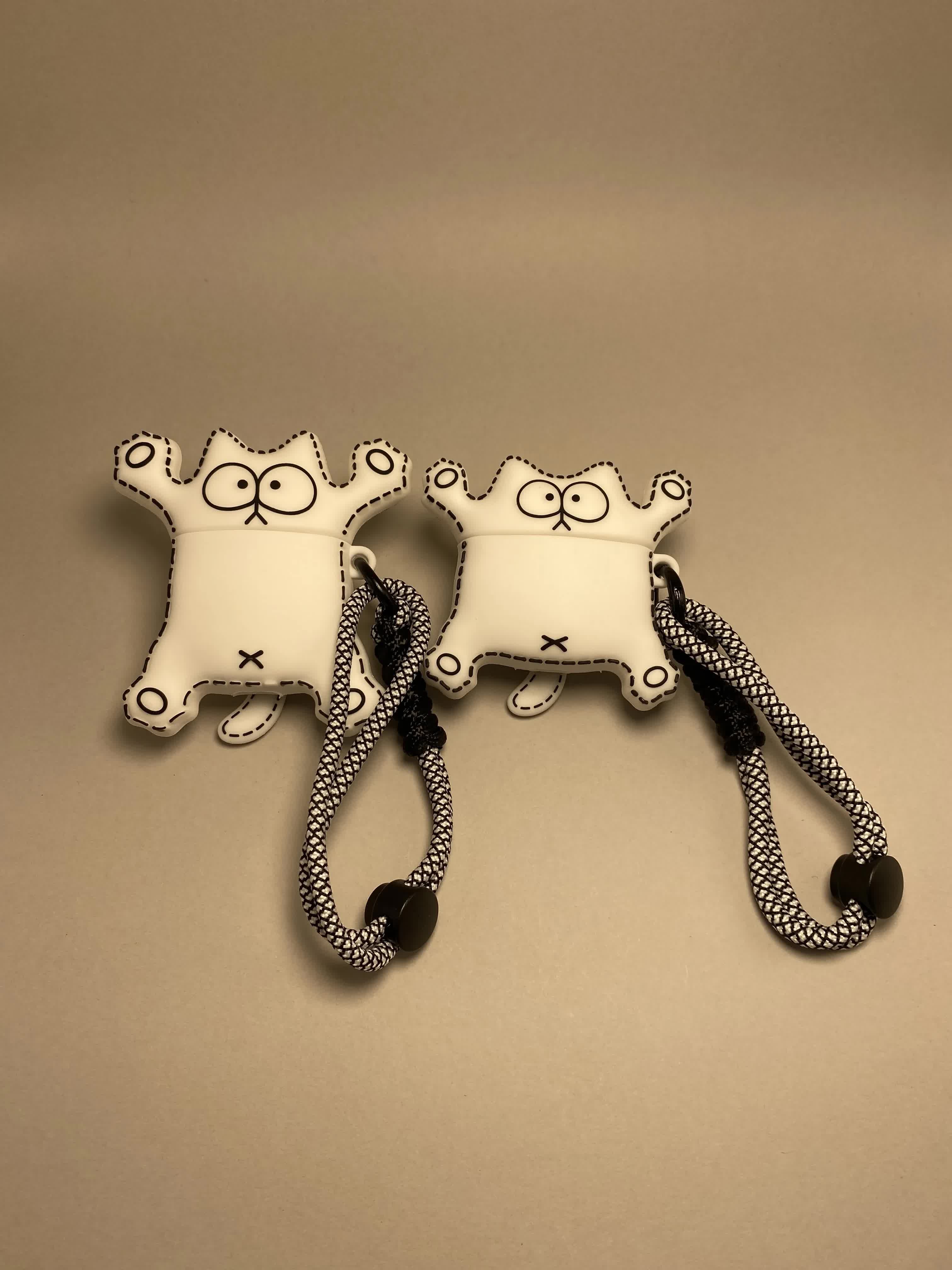 Lanyard con diseño de gato en línea artística + patrón de líneas en blanco y negro.