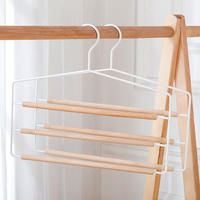 Cintre à pantalons multi-niveaux en métal et fer avec barres rondes en bois pour armoire et séchage du linge