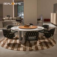 Table à manger ronde Arches, table de dîner de luxe italienne en marbre Karacatta avec plateau tournant en noyer et base en marbre pour salle à manger de villa