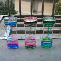 FKYTION Porte-clés à bulles liquides, lot de 8 – Légers, colorés, design sablier, jouets apaisants et relaxants, série arc-en-ciel