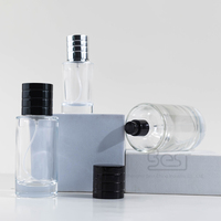 Flacon de parfum en verre rond transparent rechargeable de haute qualité de 25 ml 30 ml 50 ml 100 ml avec couvercle noir/argent disponible