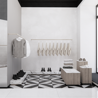 Étagère de présentation de vêtements en bois moderne et personnalisée pour les boutiques de vêtements