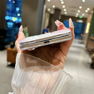 เคสโทรศัพท์ iPhone Duo 18 Fold ลายดาวทะเลเกาหลีวิบวับ ประดับเปลือกหอยและโลมา พร้อมสายคล้องลูกปัด ดีไซน์เก๋ไก๋ทันสมัย - Product Image 6