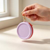 Pochette de maquillage circulaire en silicone, sac de rangement pour écouteurs, rouge à lèvres, câble de données, sac portable à fermeture éclair avec porte-clés