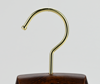 Cintre de luxe en bois de hêtre antique avec barre floquée à des niveaux simples pour vêtements pour salon