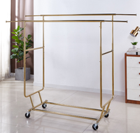 Porte-vêtements pliable télescopique sur pied réglable, support de séchage et de rangement en métal de luxe.