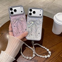 Nouvelle coque de téléphone de luxe à motif coquillage avec nœud papillon en papier pour iPhone 18 17 16 15 14 Pro Max avec cordon perlé et protection antichoc