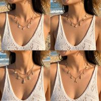 Collier en alliage plaqué or avec pendentif perle, soleil, étoile de mer et coquillage - Style décontracté estival pour les vacances à la plage