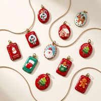 Pendentifs en résine UV de Noël en acier inoxydable, motifs mignons de Père Noël, bonhomme de neige, renne, accessoires de décoration à suspendre DIY, Dongguan