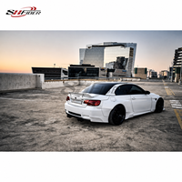 Kit carrosserie large Rocket Bunny pour BMW M3 E92 E93, comprenant pare-chocs avant, spoiler, ailes et aileron arrière en fibre de verre.