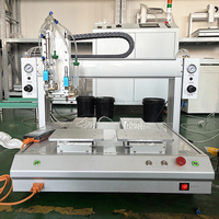 Machine de distribution entièrement automatique à double tête et deux stations pour seringues de colle époxy, UV et thermofusible avec fonction de revêtement et de goutte-à-goutte