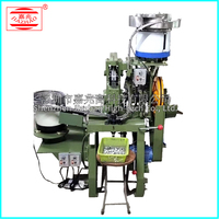 Nouvelle machine pneumatique de perforation de boucles en jean haute précision pour le traitement de boucles à ressort en métal à cinq griffes quatre-en-un pour jeans