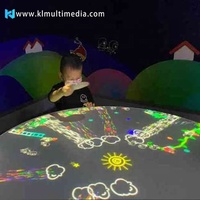 Mesa de juegos interactiva 3D redonda para niños, máquina digital eléctrica todo en uno para juegos de proyección de vídeo gestual en restaurante