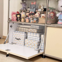 Vitrine modulaire en verre style USM avec cadre en métal chromé et base verrouillable, présentoir multi-grilles pour figurines et objets artisanaux