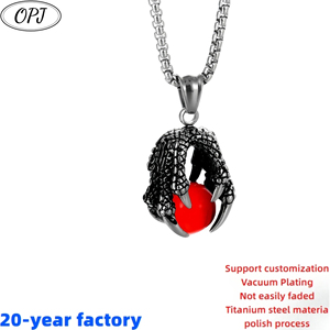 Vente en gros de pendentifs de style hip-hop européen et américain incrustés de pierres précieuses, griffes de dragon coulé, collier boule rouge - Product Image 1