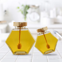 Best-seller pot à miel en verre pot à miel unique avec louche en bois pot hexagonal en verre pour miel 100ml 220ml 380ml en stock
