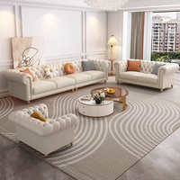 Canapé en cuir véritable de style français, trois places, en forme de L, couleur crème, pieds en bois massif, détails zippés, luxe léger, salon