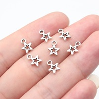 Colgante de estrella calada de 8.5x6.2mm de aleación de zinc plateado envejecido para la creación de collares celestiales